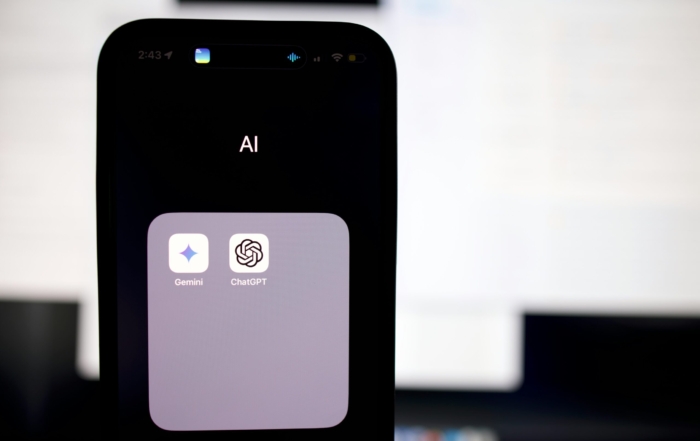 a close up of a cell phone with an ai button