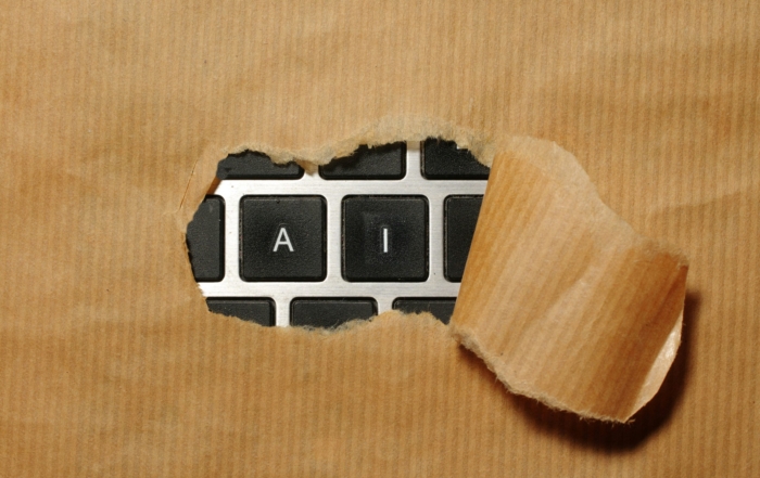 A piece of cardboard with a keyboard appearing through it